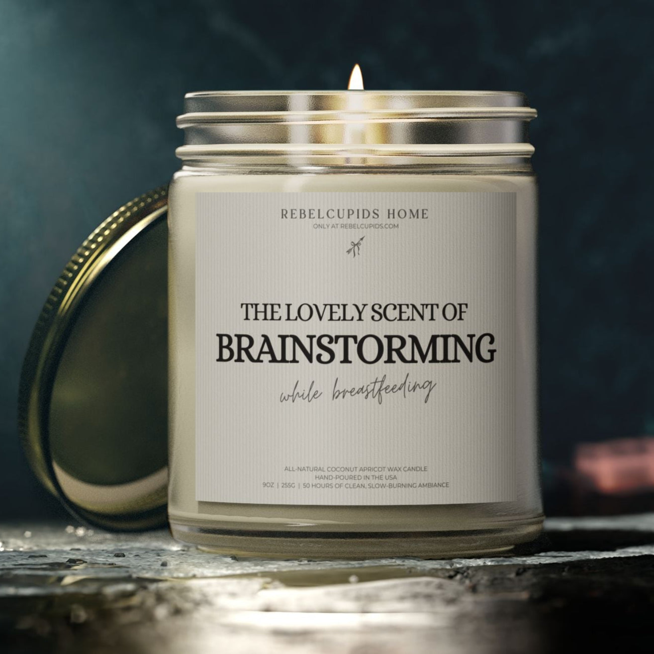Candle with a label on a dark background