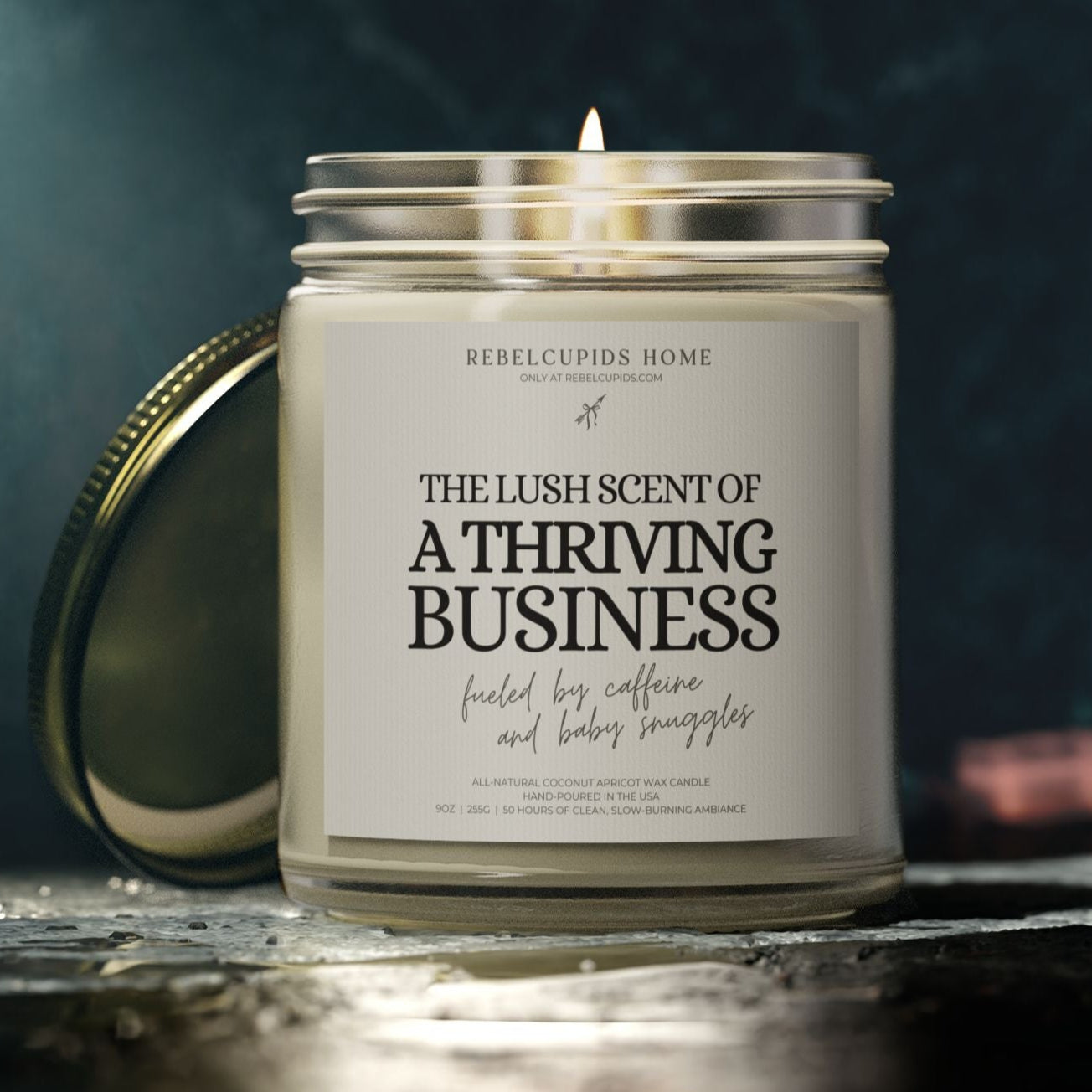 Candle with a label on a dark background