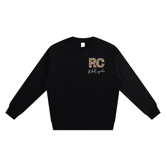 Black sweatshirt with 'RC' logo on a white background