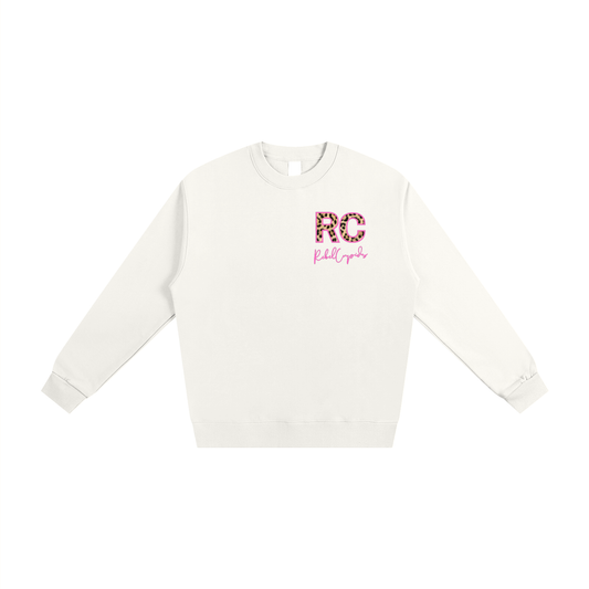 White sweatshirt with 'RC' logo on a white background